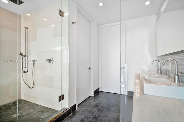 bathroom featuring walk in shower and sink