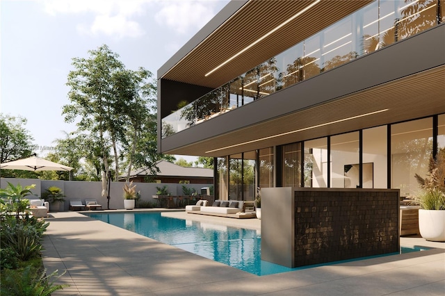 view of pool with an outdoor living space and a patio area