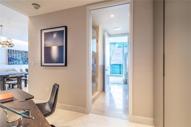 home office featuring a notable chandelier and light tile patterned floors