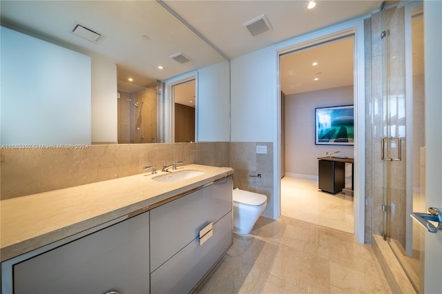 bathroom with vanity, toilet, and walk in shower