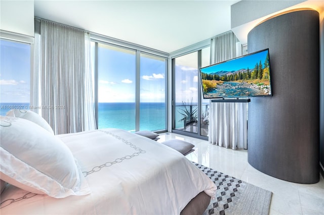 bedroom with access to outside, tile patterned flooring, and floor to ceiling windows