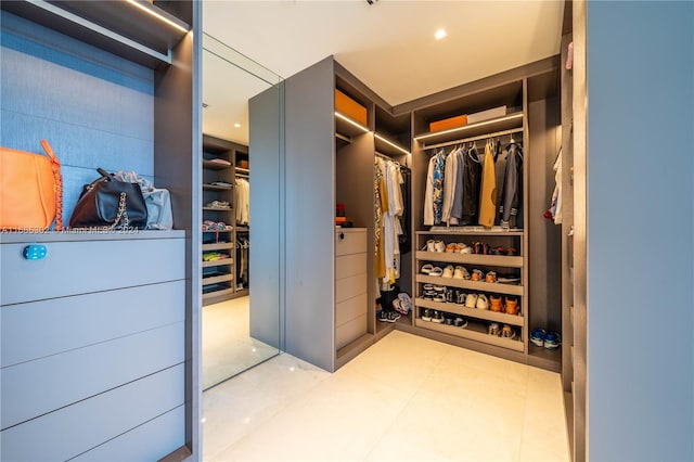 walk in closet featuring light tile patterned floors