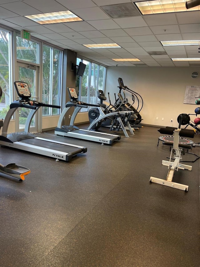 exercise room featuring a drop ceiling