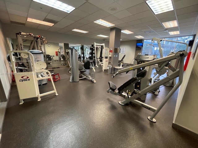 workout area featuring a paneled ceiling