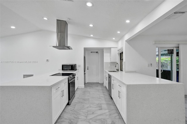 kitchen with extractor fan, lofted ceiling, appliances with stainless steel finishes, and kitchen peninsula