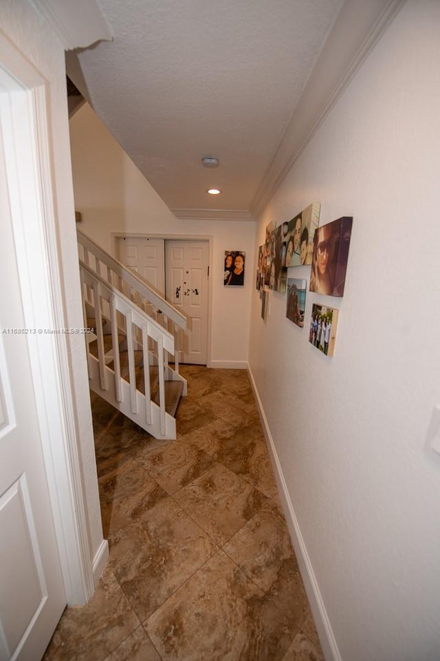 corridor featuring ornamental molding