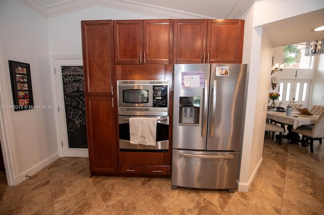 kitchen featuring a notable chandelier, ornamental molding, stainless steel appliances, and vaulted ceiling