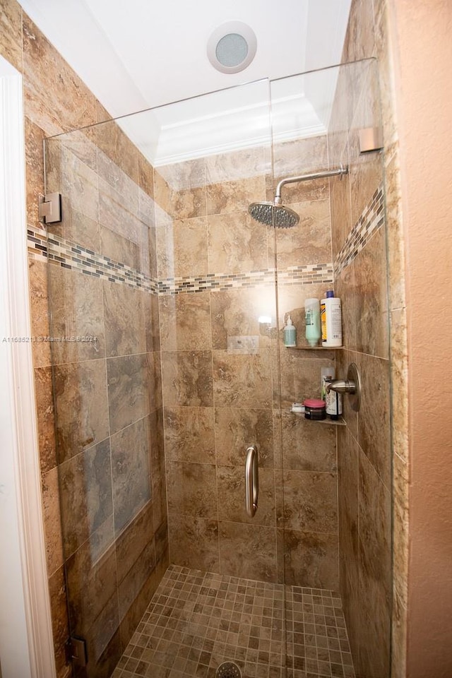 bathroom with tiled shower