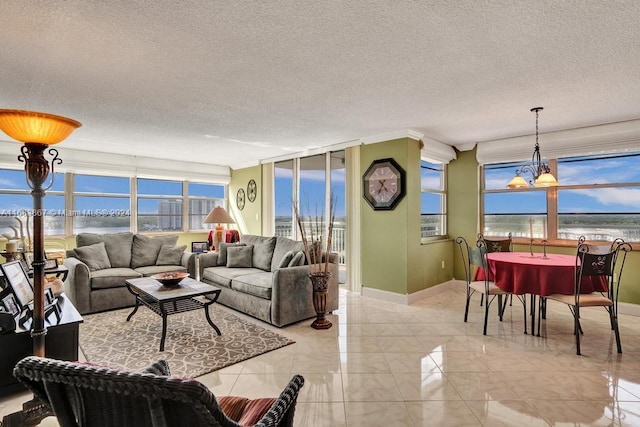 18011 Biscayne Blvd Unit 1705, Aventura, FL 33160 - living area with a water view, plenty of natural light, and a textured ceiling