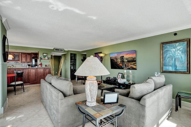 tiled living room featuring crown molding and a textured ceiling