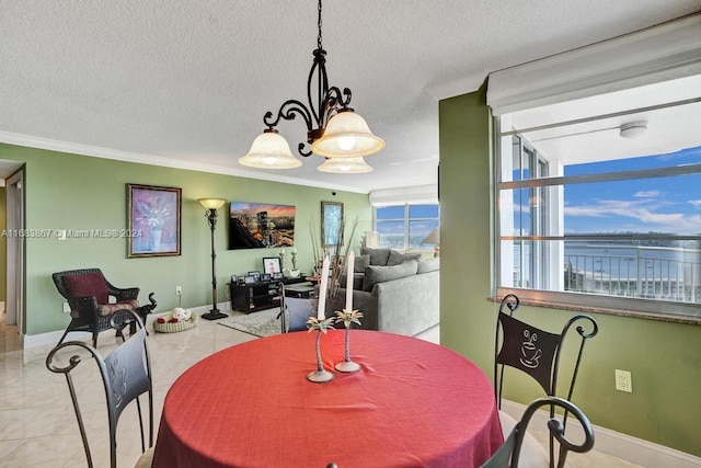 18011 Biscayne Blvd Unit 1705, Aventura, FL 33160 - dining space featuring crown molding, a chandelier, and a textured ceiling
