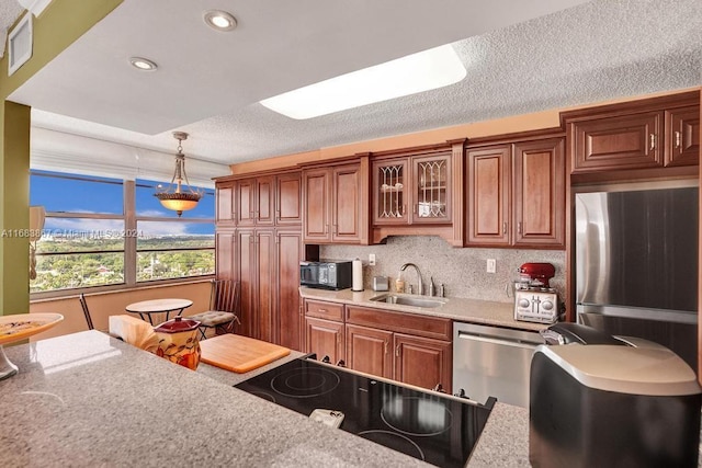 18011 Biscayne Blvd Unit 1705, Aventura, FL 33160 - kitchen with light countertops, decorative light fixtures, brown cabinetry, glass insert cabinets, and recessed lighting