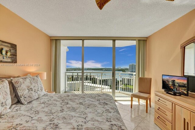 18011 Biscayne Blvd Unit 1705, Aventura, FL 33160 - bedroom featuring a wall of windows, access to exterior, and a textured ceiling