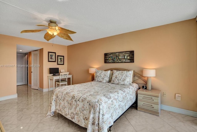 18011 Biscayne Blvd Unit 1705, Aventura, FL 33160 - bedroom with light marble finish floors, a textured ceiling, and ceiling fan