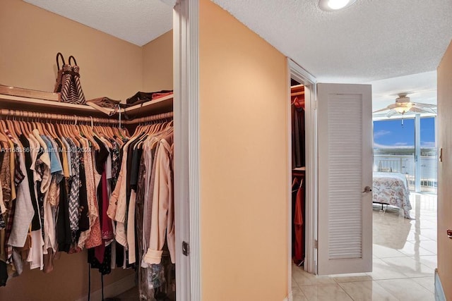 18011 Biscayne Blvd Unit 1705, Aventura, FL 33160 - spacious closet featuring a ceiling fan and light tile patterned flooring