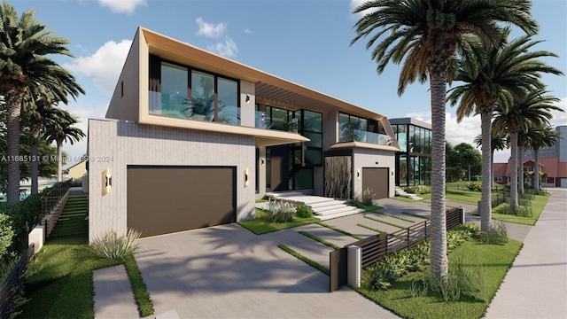 contemporary home featuring a garage and a balcony