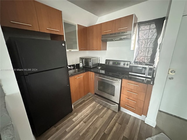 kitchen featuring dark hardwood / wood-style flooring, sink, and stainless steel appliances