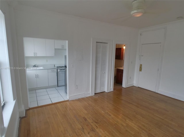 interior space featuring sink and light wood-type flooring