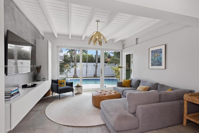 living room featuring an inviting chandelier and beam ceiling