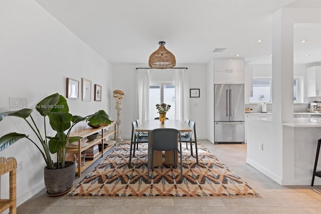 dining space featuring visible vents and recessed lighting