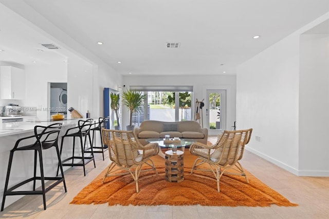 1610 S Bayshore Dr, Miami, FL 33133 - living room with recessed lighting and stacked washer and clothes dryer