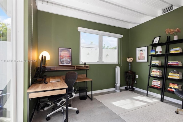 home office featuring beam ceiling