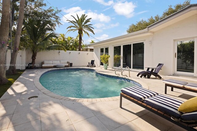 1610 S Bayshore Dr, Miami, FL 33133 - view of swimming pool featuring a patio and a fenced backyard