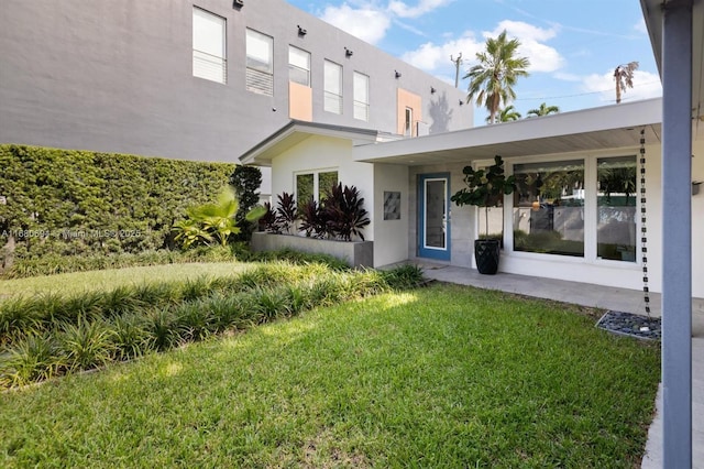 rear view of house with a lawn