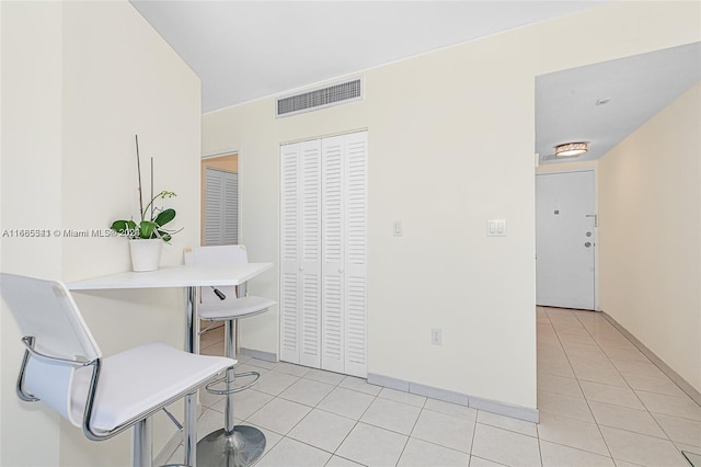 dining space with light tile patterned flooring