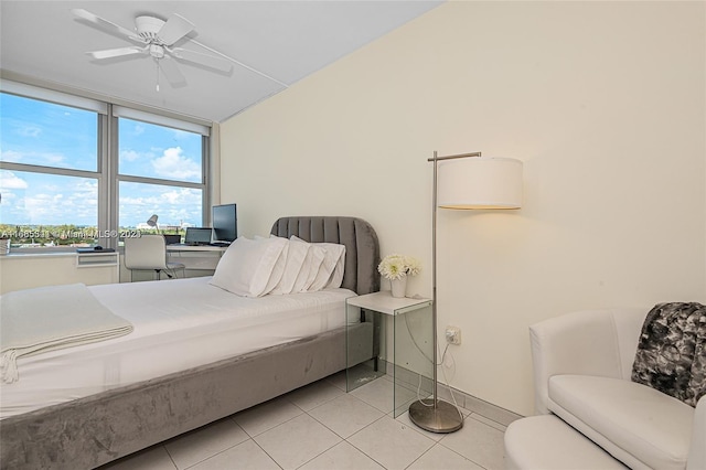 tiled bedroom with ceiling fan