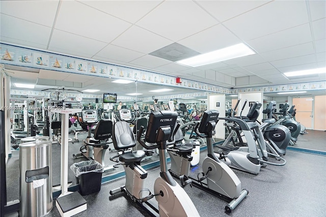 exercise room with a drop ceiling