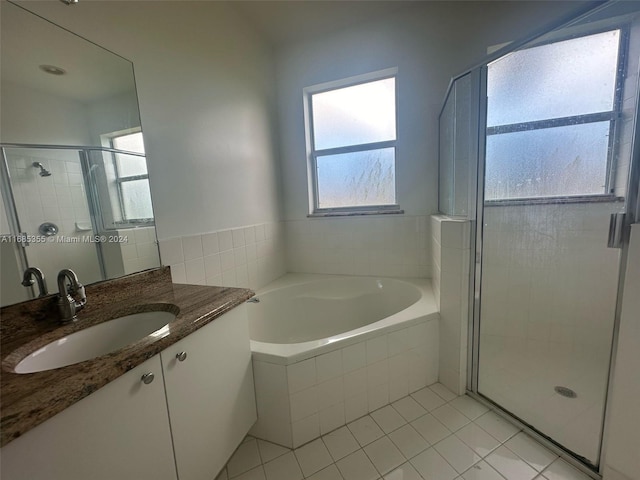 bathroom with vanity, tile patterned flooring, and separate shower and tub