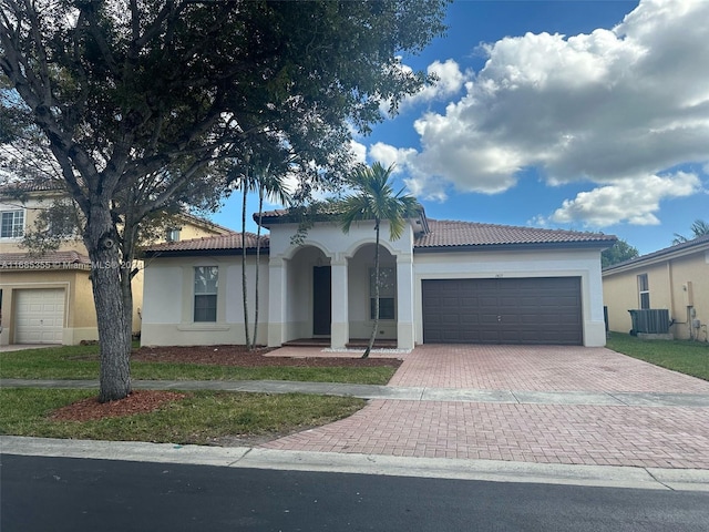 mediterranean / spanish home with a front lawn