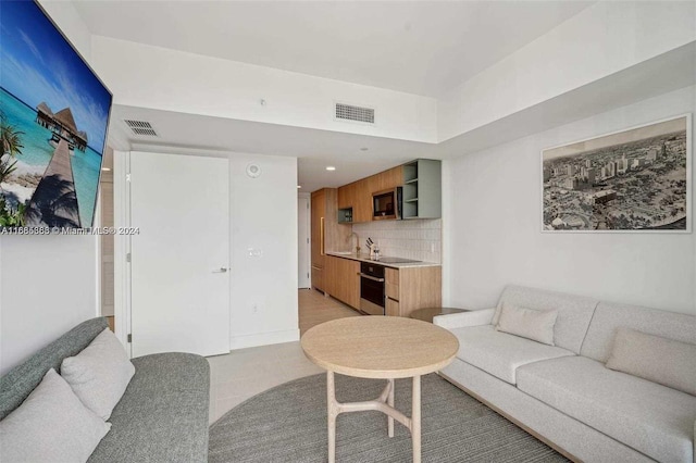 living room with light tile patterned flooring