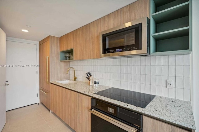 601 Ne 1st 4114, Miami, FL 33132 - kitchen with open shelves, oven, stainless steel microwave, a sink, and black electric cooktop