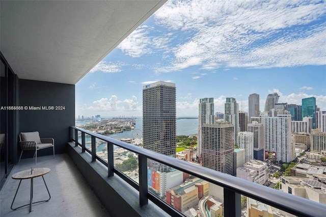 balcony featuring a water view