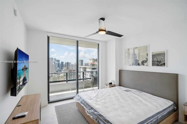 bedroom featuring expansive windows, access to exterior, light tile patterned flooring, and ceiling fan