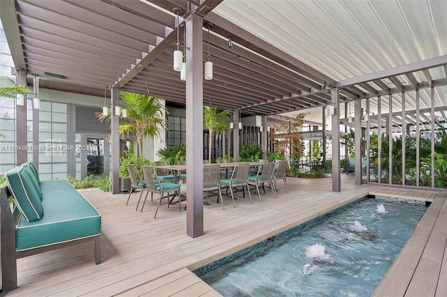 view of pool with a hot tub and a deck