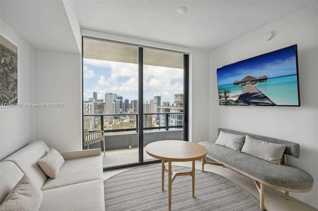 living room with expansive windows and plenty of natural light