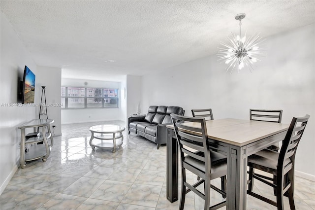 dining room with a chandelier and a textured ceiling