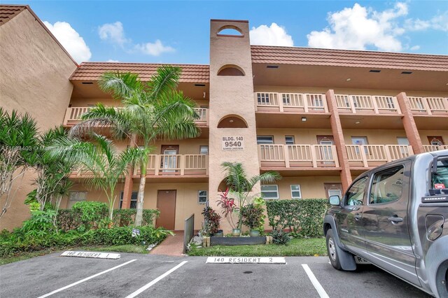 9540 Sunrise Lakes Blvd Unit 103, Sunrise, FL 33322 - view of apartment building / complex with uncovered parking