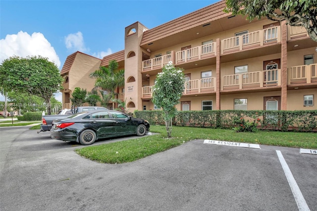 9540 Sunrise Lakes Blvd Unit 103, Sunrise, FL 33322 - view of building exterior featuring uncovered parking