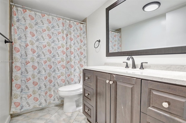 bathroom with vanity, toilet, and walk in shower