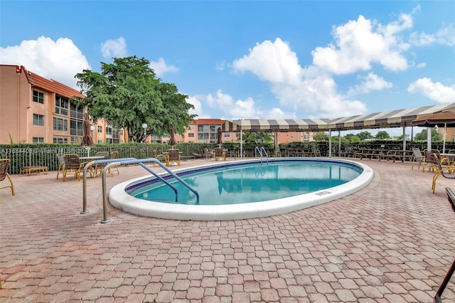 view of pool featuring a patio area