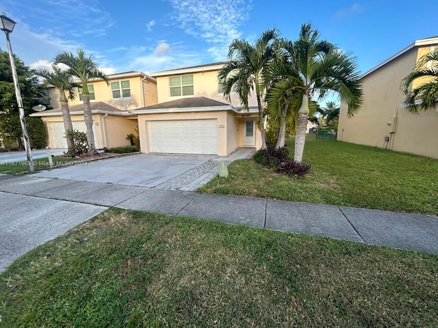 view of front facade featuring a garage and a front lawn