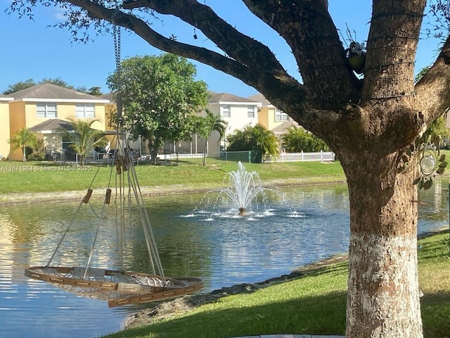 water view featuring fence