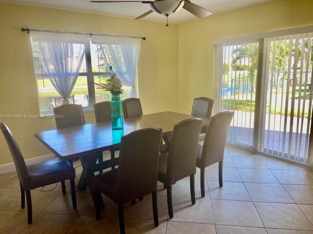 tiled dining room with ceiling fan