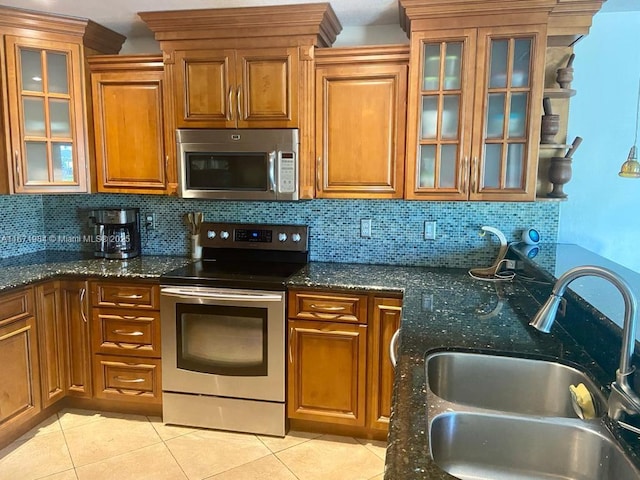 4046 Eastridge Dr, Deerfield Beach, FL 33064 - kitchen featuring a sink, brown cabinets, and appliances with stainless steel finishes