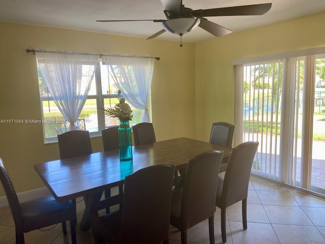 dining area with ceiling fan and light tile patterned floors