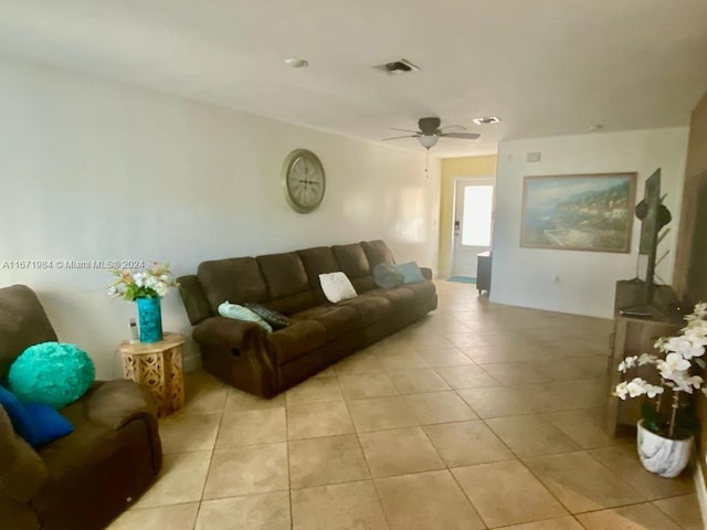 tiled living room featuring ceiling fan